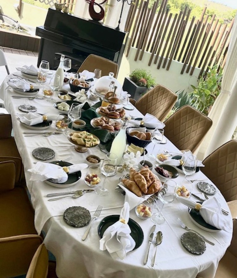 Brunch table set with pastries and small plates